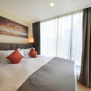 Kamer met een Queen Size Bed in een Bijgebouw